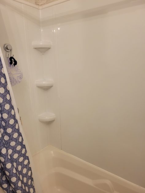 clean bathroom view of shower shelves