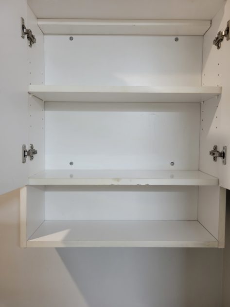 cleaned bathroom view inside cabinet above toilet