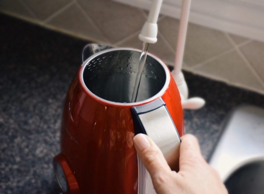 filling tea kettle with water